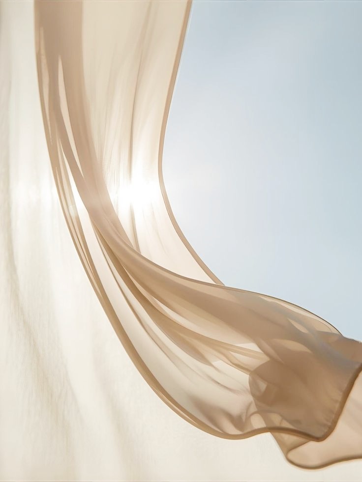 Elegant wedding fabric against a soft coastal sky at Nobu Hotel